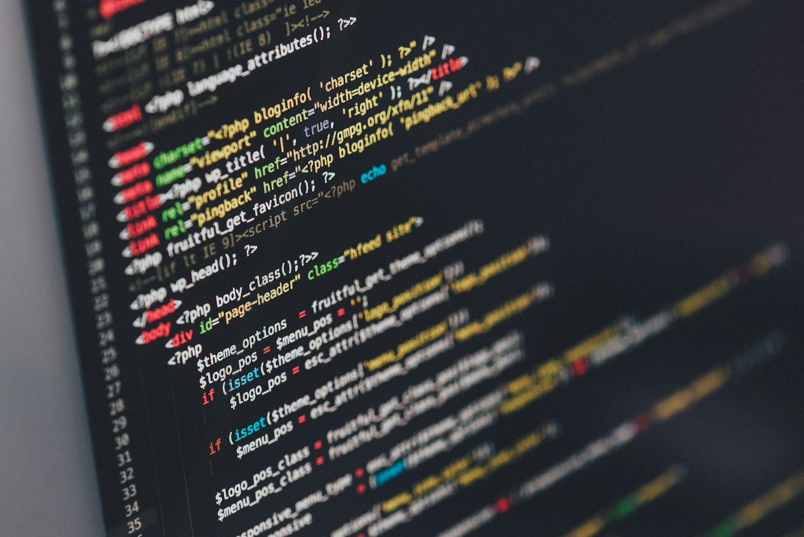 Colourful source code on a dark editor screen